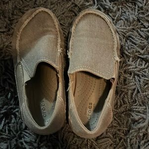 Boys slip in croc shoes